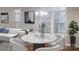 Bright dining area with a round marble table and white chairs at 8540 Filbert Ln, Charlotte, NC 28215