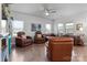 Living room with hardwood floors and comfortable leather seating at 8932 Pennegrove Cir, Charlotte, NC 28214