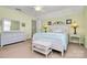 Bedroom with a double bed and white wicker furniture at 9021 Gander Dr, Charlotte, NC 28277