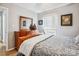 Bedroom featuring hardwood floors, dresser, natural light, and a wooden bed frame at 914 Jaywood Ln, Matthews, NC 28105