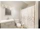 Clean bathroom with shower/tub combo and gray vanity at 92 Saint Charles Ne Ave, Concord, NC 28025