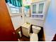 Small bathroom with toilet, sink, and overhead cabinet at 947 Ravendale Dr, Charlotte, NC 28216