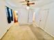 Spacious bedroom with carpet flooring and access to bathroom at 947 Ravendale Dr, Charlotte, NC 28216