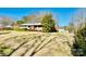 Ranch style home with a large front yard at 947 Ravendale Dr, Charlotte, NC 28216