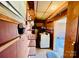 Laundry area with washer, dryer, and ample shelving at 947 Ravendale Dr, Charlotte, NC 28216