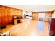 Hardwood floor living room, view of kitchen and fireplace at 947 Ravendale Dr, Charlotte, NC 28216