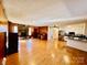 Spacious living room with hardwood floors and a stone fireplace at 947 Ravendale Dr, Charlotte, NC 28216