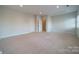 Spacious bedroom with carpet and additional room access at 9713 White Frost Rd, Charlotte, NC 28277