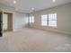 Spacious bedroom with neutral walls and carpet at 9713 White Frost Rd, Charlotte, NC 28277