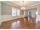 Formal dining room with hardwood floors and chandelier at 9713 White Frost Rd, Charlotte, NC 28277