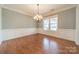 Formal dining room with hardwood floors and wainscoting at 9713 White Frost Rd, Charlotte, NC 28277