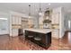 Spacious kitchen with large island, granite counters, and stainless steel appliances at 9713 White Frost Rd, Charlotte, NC 28277