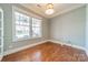 Bright home office with hardwood floors and large windows at 9713 White Frost Rd, Charlotte, NC 28277