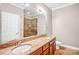 Bathroom boasts granite double vanity and a walk-in shower at 1000 E Woodlawn Rd # 105, Charlotte, NC 28209