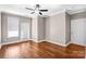 Bright bedroom with hardwood floors and sliding glass door at 1000 E Woodlawn Rd # 105, Charlotte, NC 28209