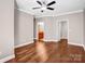 Spacious bedroom with hardwood floors and access to bathroom at 1000 E Woodlawn Rd # 105, Charlotte, NC 28209
