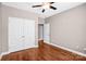 Bedroom with hardwood floors and double door closet at 1000 E Woodlawn Rd # 105, Charlotte, NC 28209