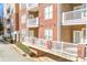 Brick building with private balconies and ground level parking at 1000 E Woodlawn Rd # 105, Charlotte, NC 28209