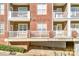 Brick building with multiple units and private balconies at 1000 E Woodlawn Rd # 105, Charlotte, NC 28209