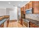 Modern kitchen with stainless steel appliances and granite countertops at 1000 E Woodlawn Rd # 105, Charlotte, NC 28209