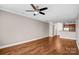 Spacious living room with hardwood floors and kitchen access at 1000 E Woodlawn Rd # 105, Charlotte, NC 28209