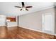 Hardwood floor living room with access to balcony at 1000 E Woodlawn Rd # 105, Charlotte, NC 28209