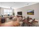 Open living and dining area with hardwood floors at 1000 E Woodlawn Rd # 105, Charlotte, NC 28209