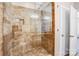 Large walk-in shower with tile surround and built-in seat at 1000 E Woodlawn Rd # 105, Charlotte, NC 28209