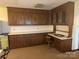 Kitchen boasts ample wood cabinetry and counter space at 1033 Mocksville Hwy, Statesville, NC 28625