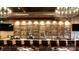 Upscale bar with extensive liquor shelving and seating at 106 N Laurel Ave # 120, Charlotte, NC 28207