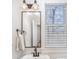Clean bathroom with white sink, mirror, and window blinds at 106 N Laurel Ave # 120, Charlotte, NC 28207