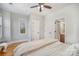 Bright bedroom with hardwood floors and access to a shared bathroom at 106 N Laurel Ave # 120, Charlotte, NC 28207