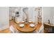 Charming dining area with round wooden table and built-in seating at 106 N Laurel Ave # 120, Charlotte, NC 28207