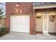 Attached two car garage with white garage door at 106 N Laurel Ave # 120, Charlotte, NC 28207