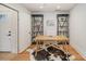 Home office with hardwood floors, built-in shelving and a desk at 106 N Laurel Ave # 120, Charlotte, NC 28207