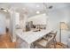Modern kitchen with white cabinets, marble countertops, and stainless steel appliances at 106 N Laurel Ave # 120, Charlotte, NC 28207