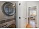 Modern laundry room with stacked washer and dryer at 106 N Laurel Ave # 120, Charlotte, NC 28207