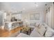 Open concept living and kitchen with island and modern appliances at 106 N Laurel Ave # 120, Charlotte, NC 28207