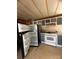 Galley kitchen with white appliances and gray cabinets at 1240 Woodridge Dr, Clover, SC 29710