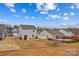 Aerial view showcasing the home's backyard and neighborhood at 140 Colonial Reserve Ave, Troutman, NC 28166
