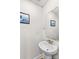 Simple bathroom with pedestal sink and mirror at 140 Colonial Reserve Ave, Troutman, NC 28166