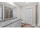 Bathroom boasts granite countertop, white cabinets and shower at 140 Colonial Reserve Ave, Troutman, NC 28166