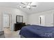 Well-lit bedroom with a queen-size bed and ample closet space at 140 Colonial Reserve Ave, Troutman, NC 28166