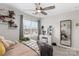 Spacious bedroom with a bed, floating shelves, and large window at 140 Colonial Reserve Ave, Troutman, NC 28166