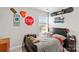 Well-lit bedroom featuring a double bed and ample wall space at 140 Colonial Reserve Ave, Troutman, NC 28166