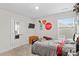 Bright bedroom with double bed, closet, and window at 140 Colonial Reserve Ave, Troutman, NC 28166