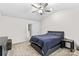 Bright bedroom featuring a comfortable bed and ceiling fan at 140 Colonial Reserve Ave, Troutman, NC 28166