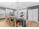 Modern kitchen with white cabinets, granite countertops, and island at 140 Colonial Reserve Ave, Troutman, NC 28166