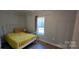 Charming bedroom with a full bed and large window at 153 Saluda St, Chester, SC 29706