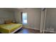 Charming bedroom with a full bed and large window at 153 Saluda St, Chester, SC 29706